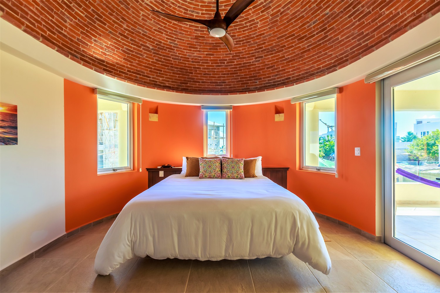 Master bedroom · brick vault ceiling and king bed